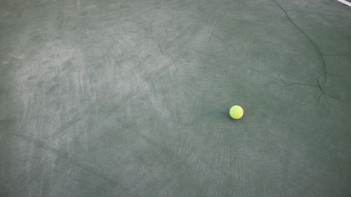 High angle view of yellow ball on bed