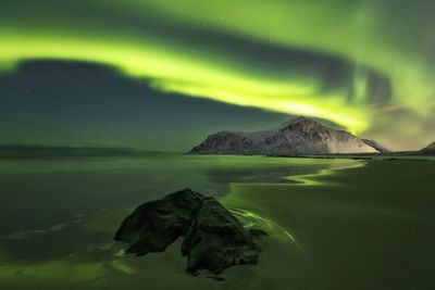 Scenic view of sea against sky at night