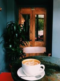 Close-up of coffee cup on table