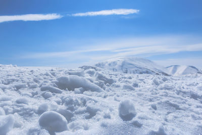 Aerial view of snowcapped mountains against sky