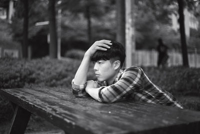 Thoughtful young man at table