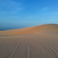 Scenic view of desert against sky