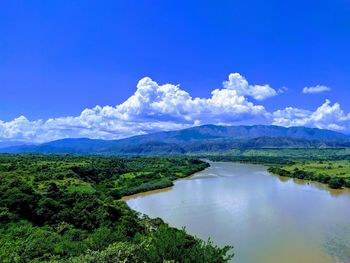 Scenic view of lake against blue sky