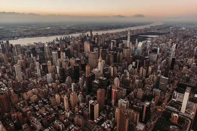 High angle view of city against sky during sunset