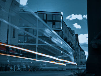 Low angle view of buildings against sky at dusk