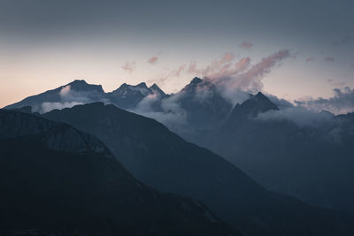 Scenic view of silhouette mountains against sky during sunset