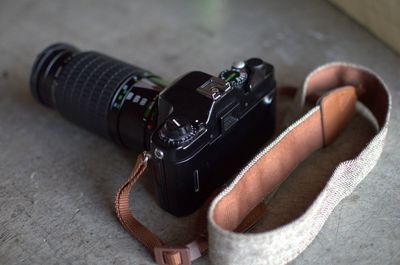 Close-up of camera on table