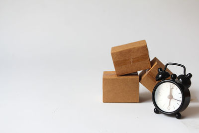 Close-up of alarm clock against white background