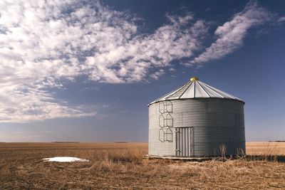 Field against cloudy sky