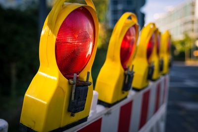 Close-up of yellow lights on road