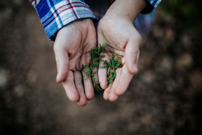 Midsection of person holding hands