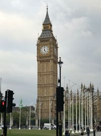 Low angle view of big ben against cloudy sky