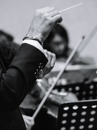 Close-up of man playing guitar