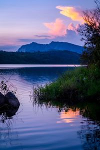 Scenic view of lake against sky during sunset