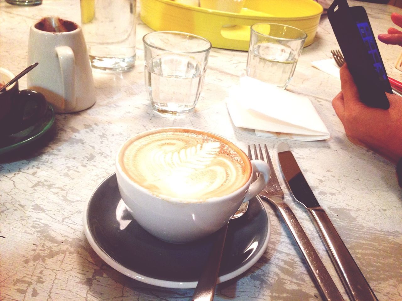 food and drink, drink, table, refreshment, indoors, coffee cup, coffee - drink, freshness, saucer, still life, frothy drink, spoon, coffee, high angle view, cappuccino, froth art, cup, close-up, beverage, drinking glass