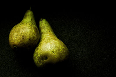 Close-up of fruit over black background