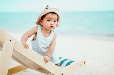 Cute baby girl on beach