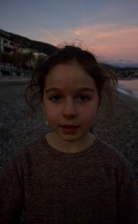 Portrait of woman at beach during sunset