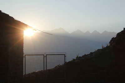 Scenic view of mountains against sky during sunset