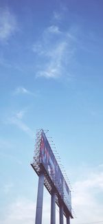 Low angle view of bridge against blue sky