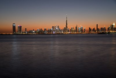 Dubai skyline from dubai creek harbour and dubai canal to downtown and business bay, uae