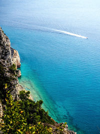 High angle view of rocks by sea