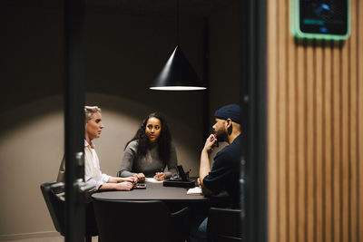 Coworkers having meeting in office