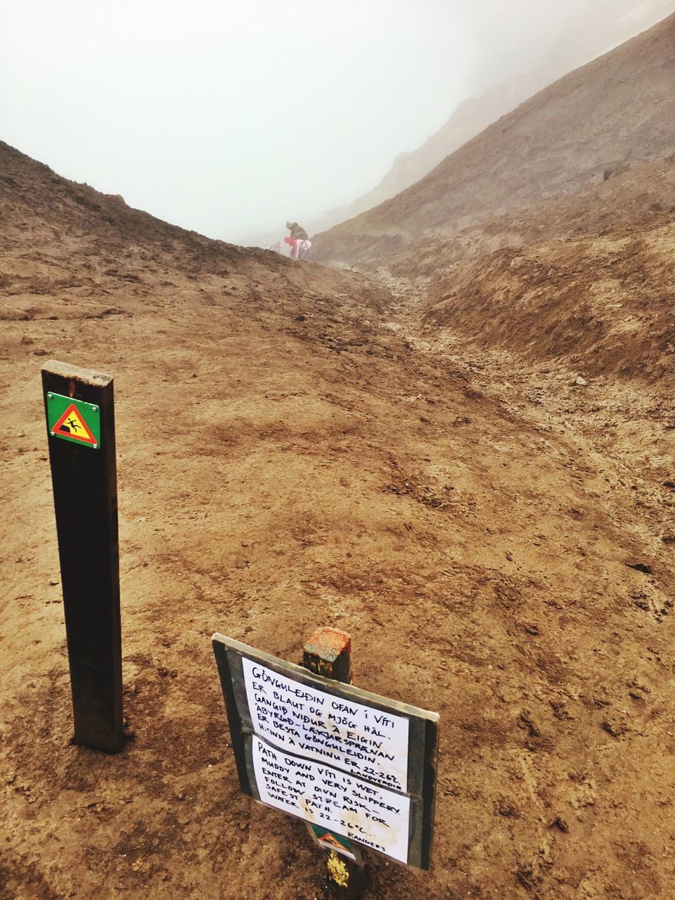 communication, text, mountain, western script, guidance, directional sign, information, tranquil scene, tranquility, signboard, outdoors, non-urban scene, memories, symbol, arid climate, adventure, solitude, countryside