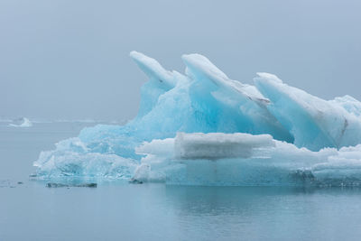 Scenic view of frozen sea against sky