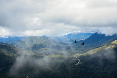 Aerial view of mountain range against sky