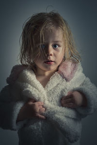 Close-up portrait of girl in bath robe