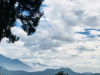 Low angle view of silhouette mountains against sky