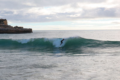 Full length of man surfing in sea