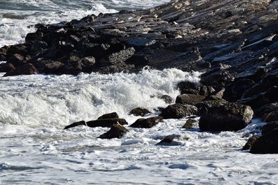 Aerial view of rocks in sea