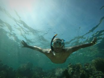 Young woman swimming in sea