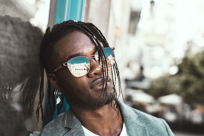 Portrait of young man wearing sunglasses