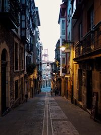 Narrow alley amidst buildings in city