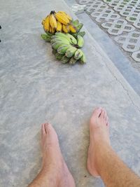 Low section of man standing on floor