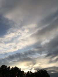 Low angle view of silhouette trees against sky during sunset