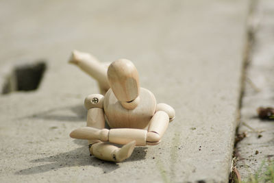 Close-up of stuffed toy on sand