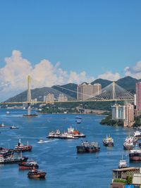 Boats in sea against clear sky