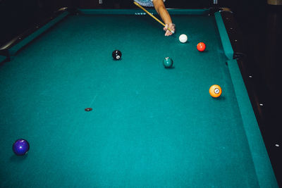 Man playing with ball in pool