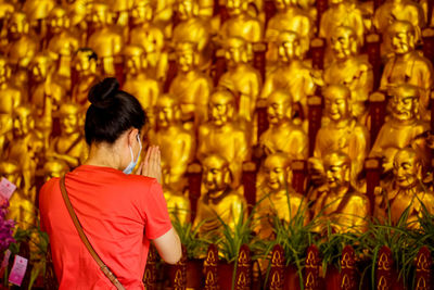 Rear view of woman looking at temple