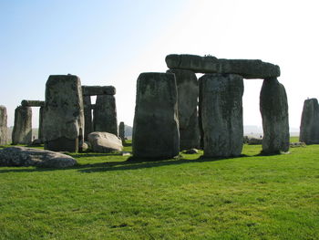 Old ruins on field against clear sky