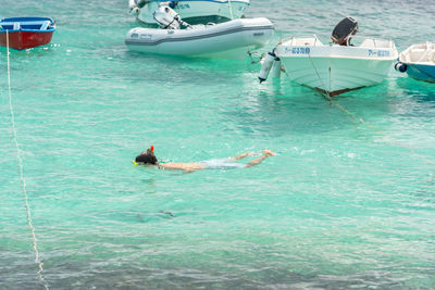 People swimming in sea