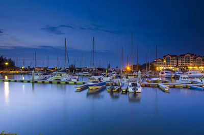 Boats moored at harbor