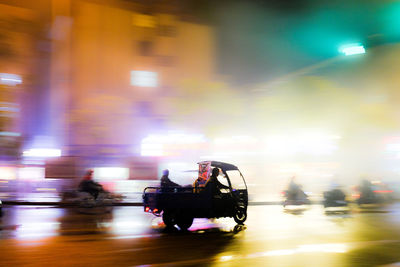 People on road at night