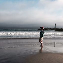 Woman standing on beach