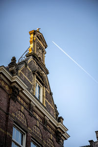 Low angle view of building against clear blue sky