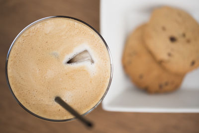 Close-up of drink with cookies on table